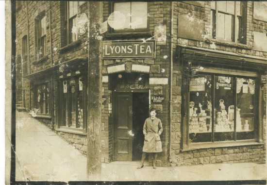 Miss Rose outside her fathers shop at School Terrace 