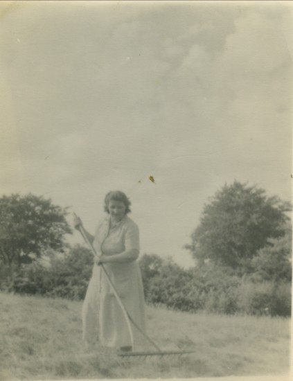 Mrs Irene Mills making hay in Wordl War II