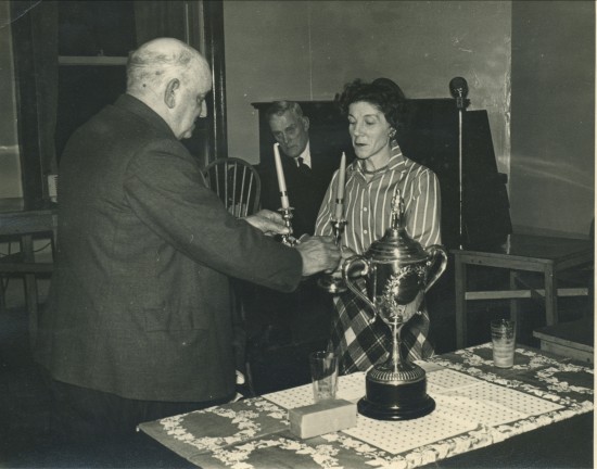 Presentation of a pair of Candlesticks to Mrs.H.Foster by Lewis Baker (Secretary of The Wales Quoiting Association)