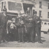 Red and White Bus with Drivers and Conductors